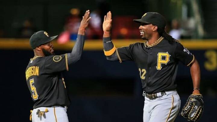 Sep 22, 2014; Atlanta, GA, USA; Pittsburgh Pirates center fielder Andrew McCutchen (22) celebrates with third baseman Josh Harrison (5) after beating the Atlanta Braves at Turner Field. Mandatory Credit: Daniel Shirey-USA TODAY Sports